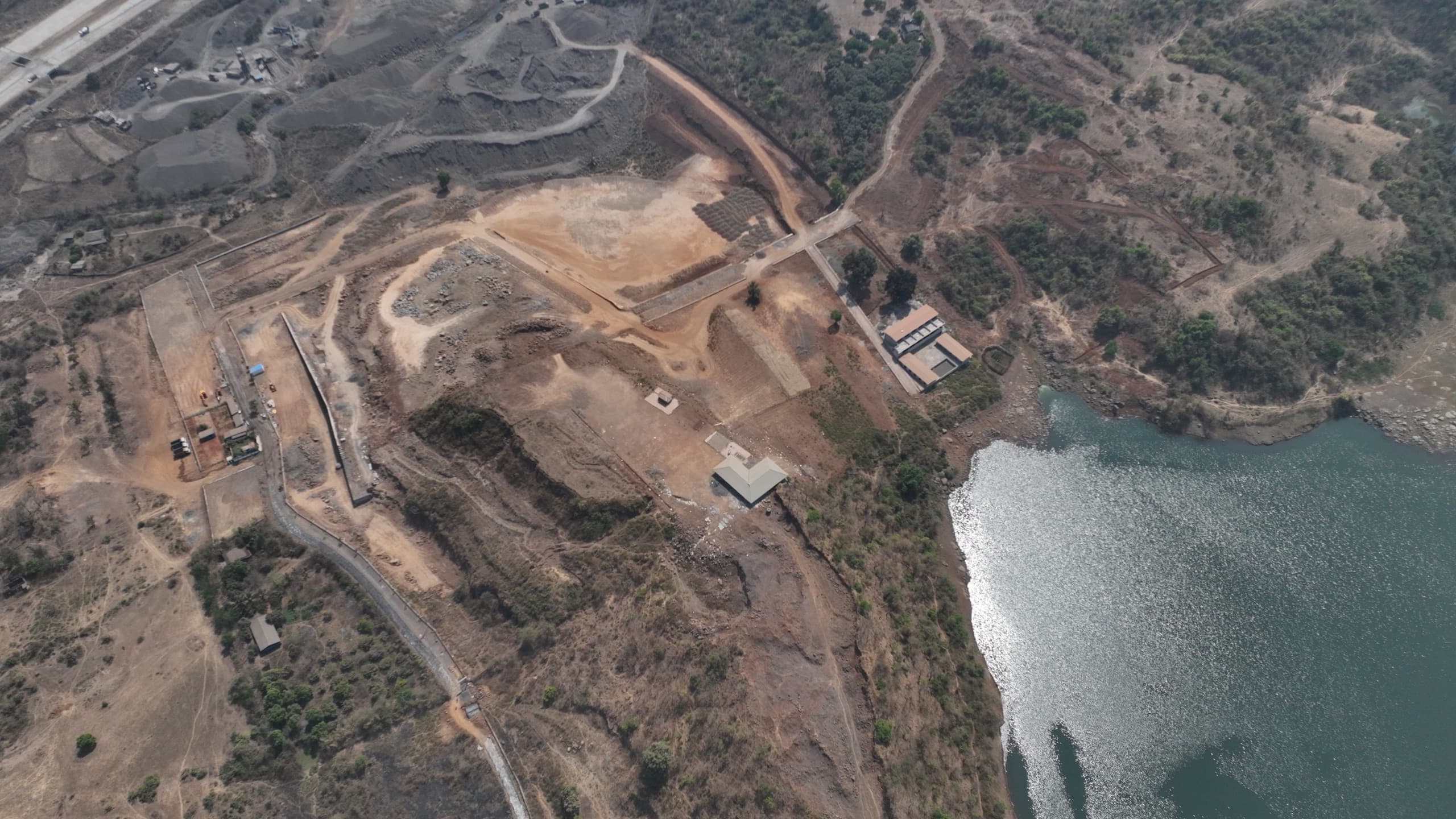 Aerial photograph of the lake along the eastern boundary of the site, with the shoreline and surrounding slopes.